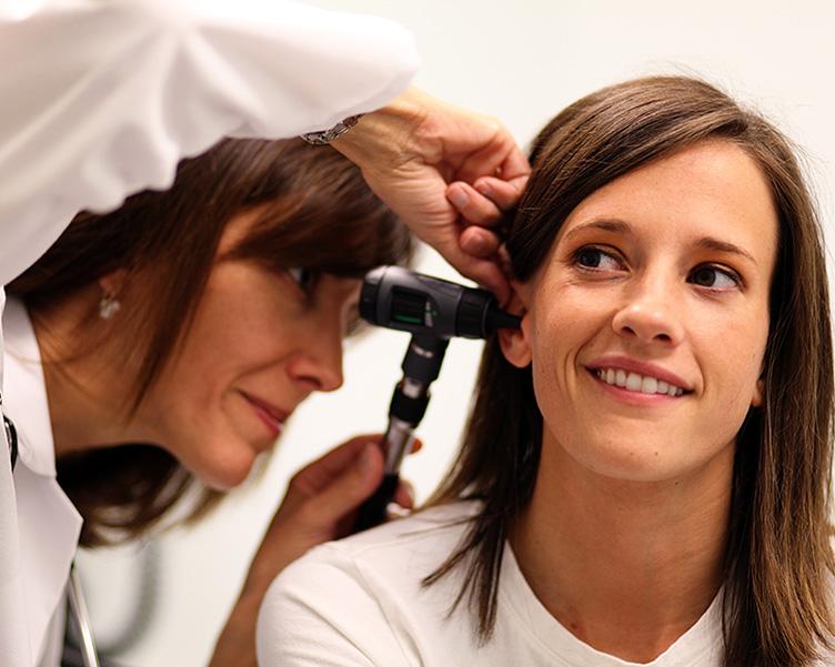 Doctor examining student